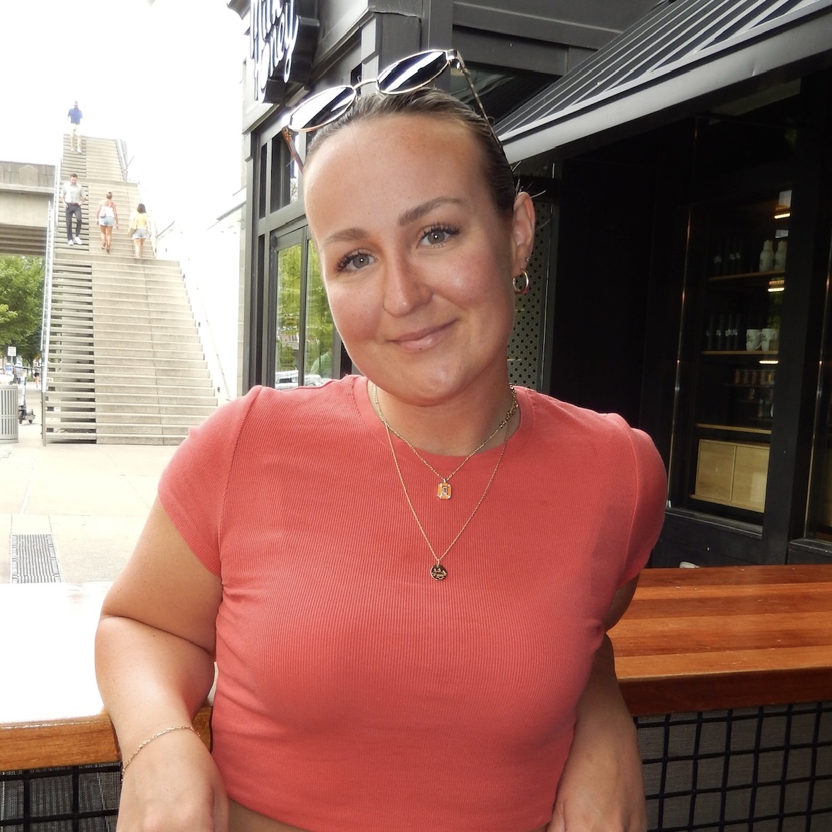 Gill wearing a red T-shirt
